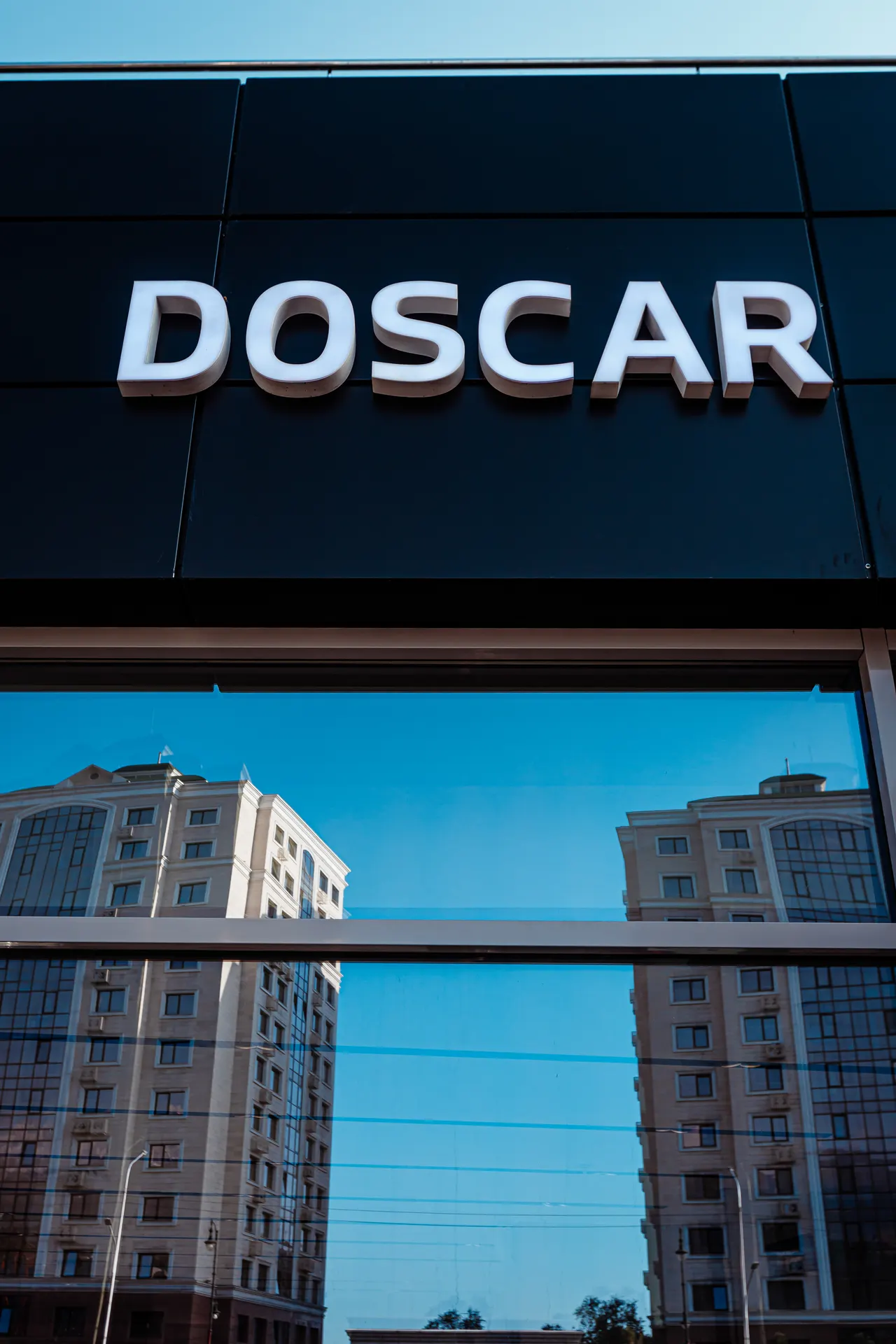 Kia / DOSCAR — dealership architecture — frame 3